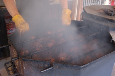 chicken cooking in barrel